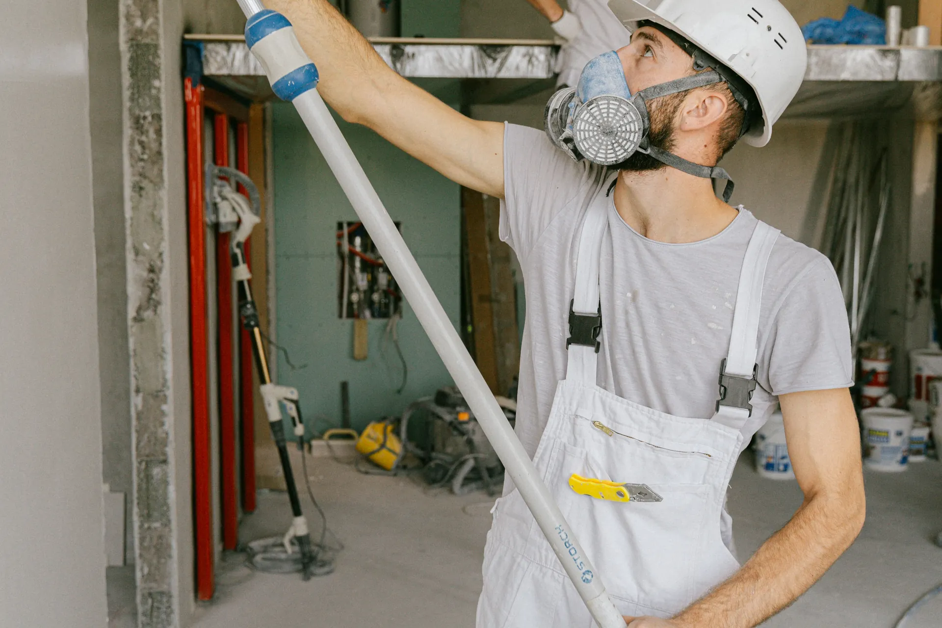 Construction workers renovating an interior space